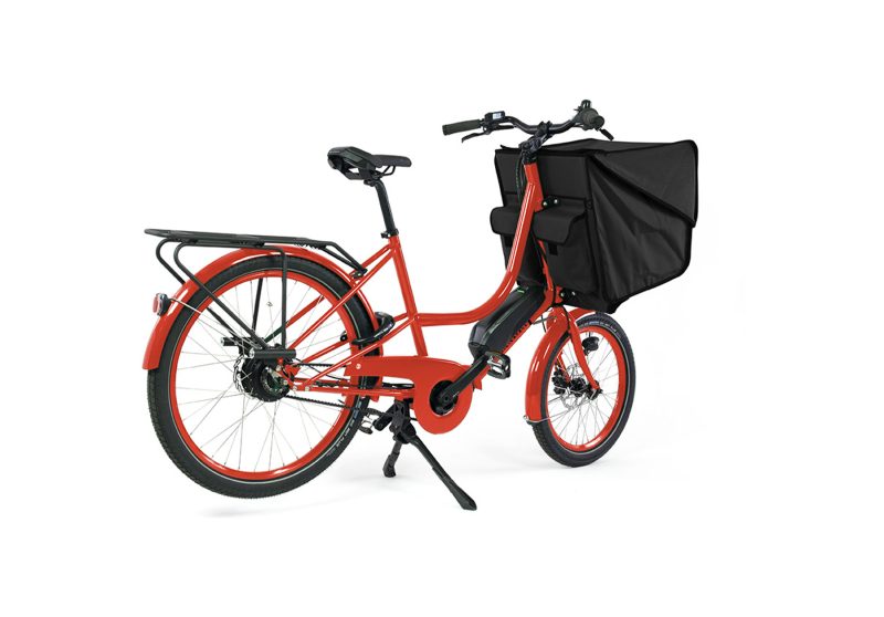 A orange Bicicapace Classicona cargo bike