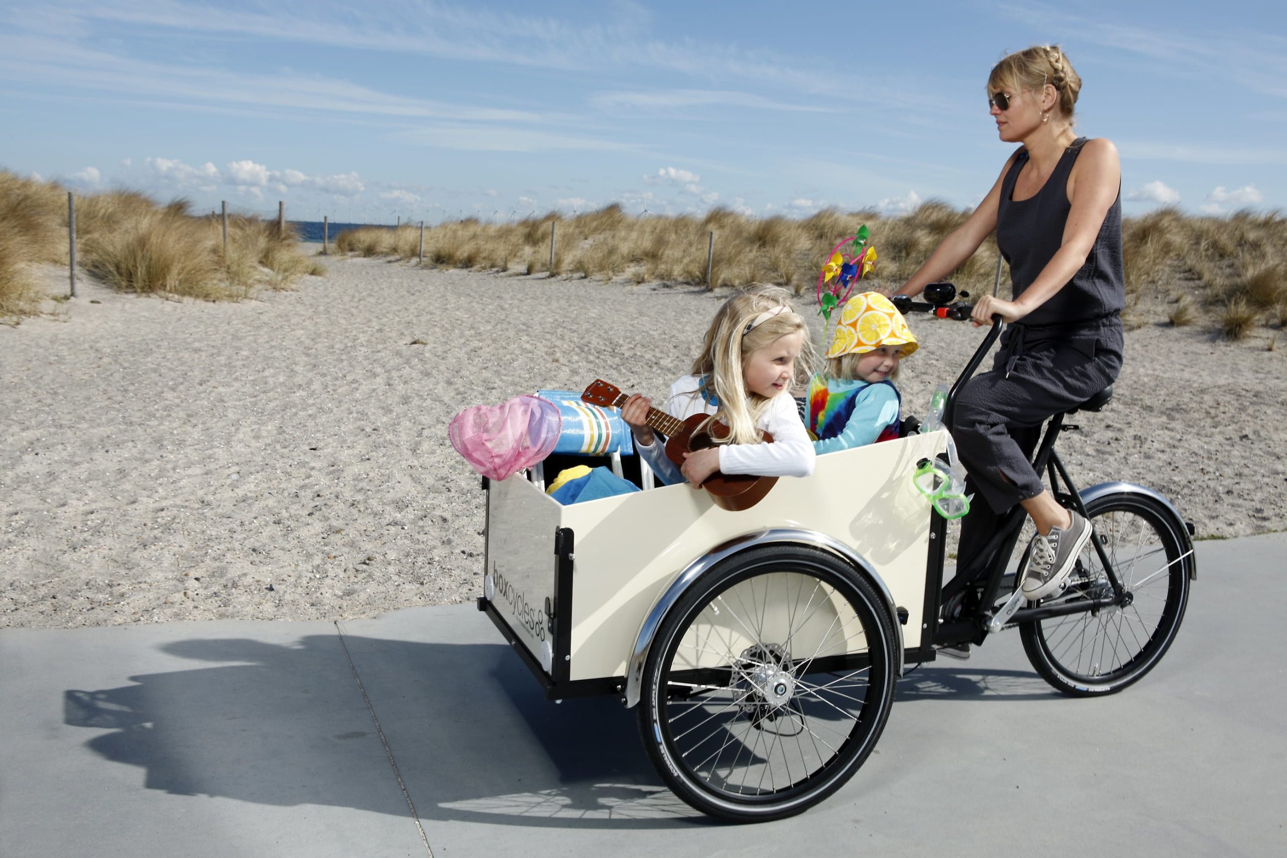 A family riding a Christiania Classic bike