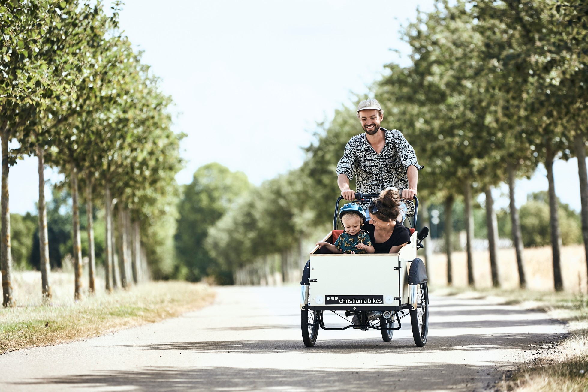 A family riding a Christiania Classic bike