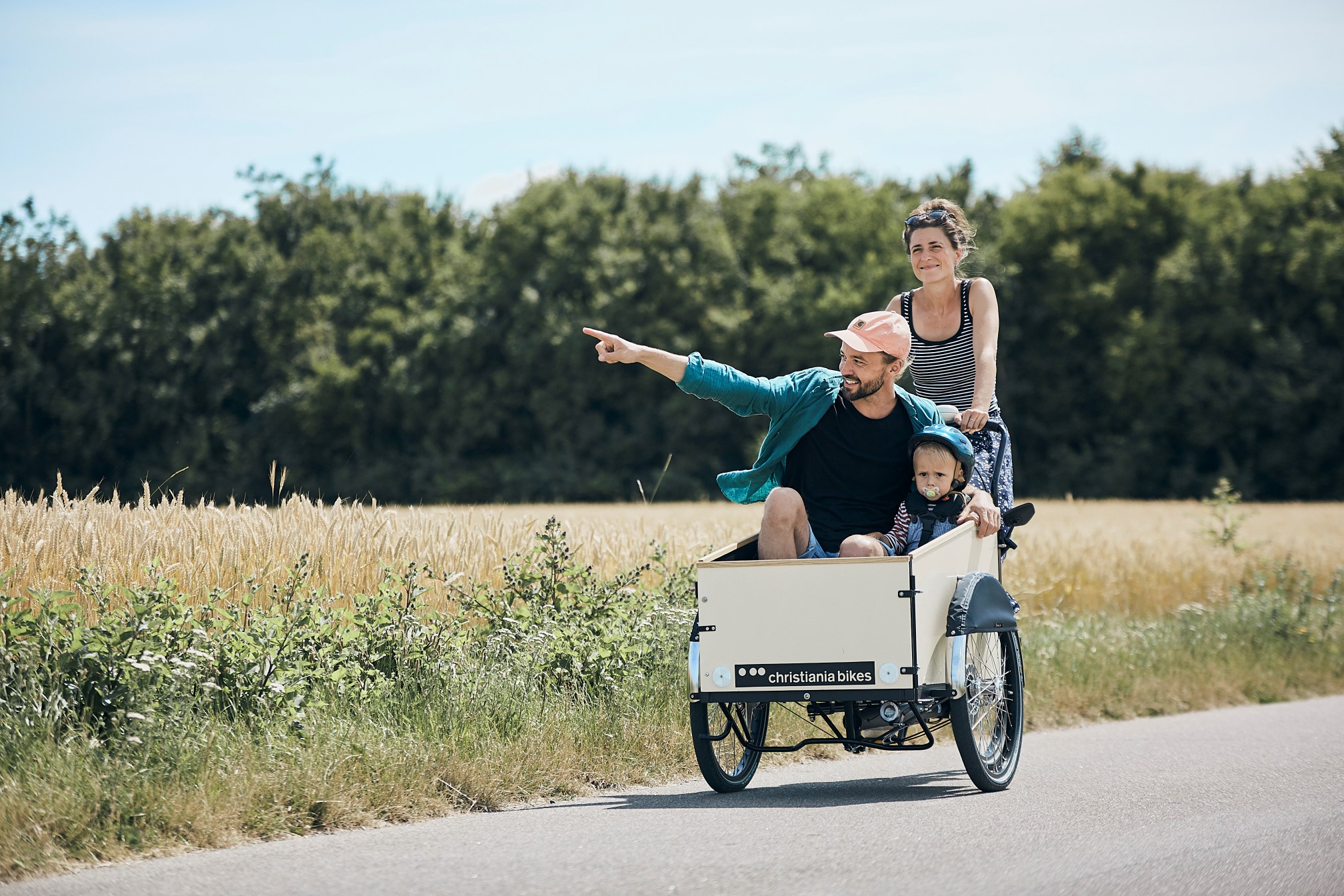A family riding a Christiania Classic bike