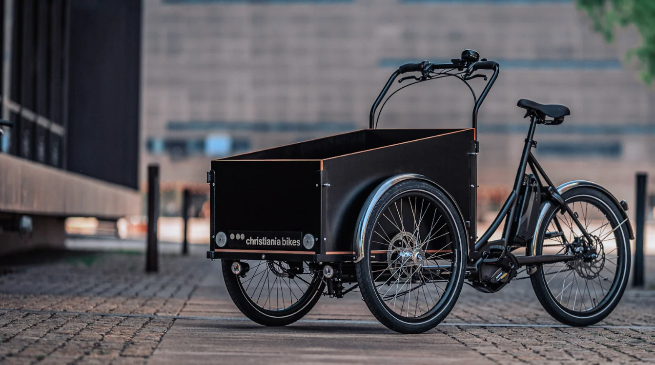 Black Christiania Classic midDrive cargo bike in urban enviroment