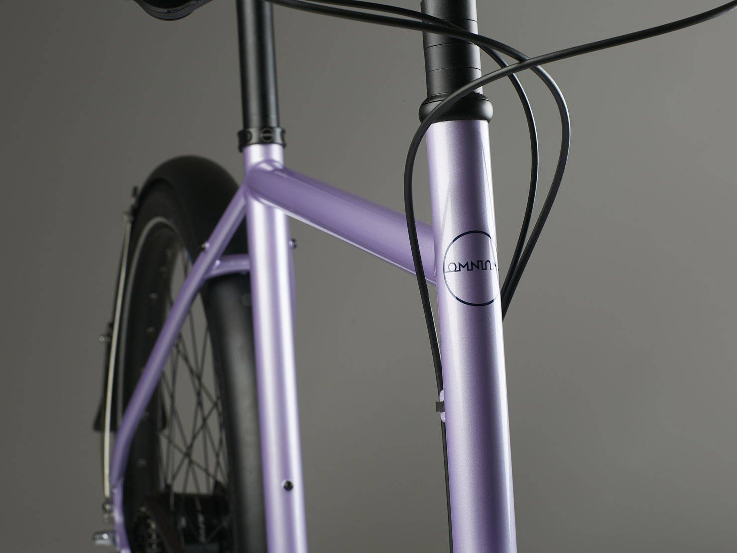 Close up of the frame of a liliac haze coloured Omnium Cargo v3 bike