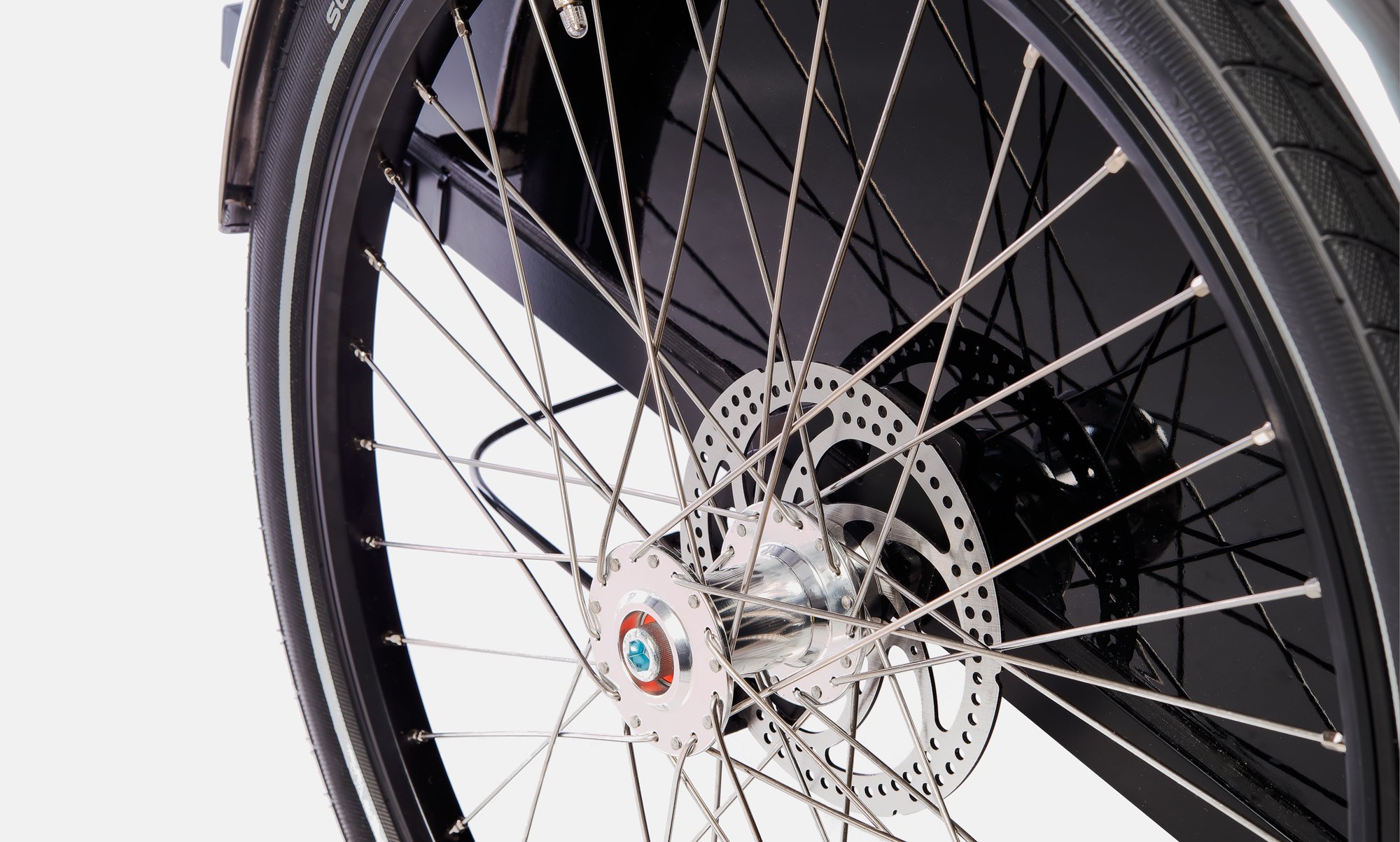 Close up of the front wheel of a Christiania cargo bike