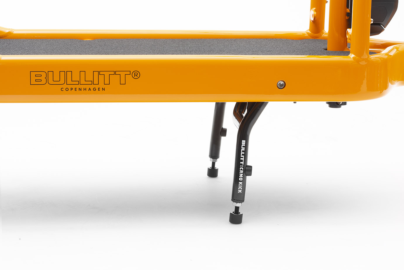 Close up of the stand of a Clockwork (orange) coloured Bullitt cargo bike 