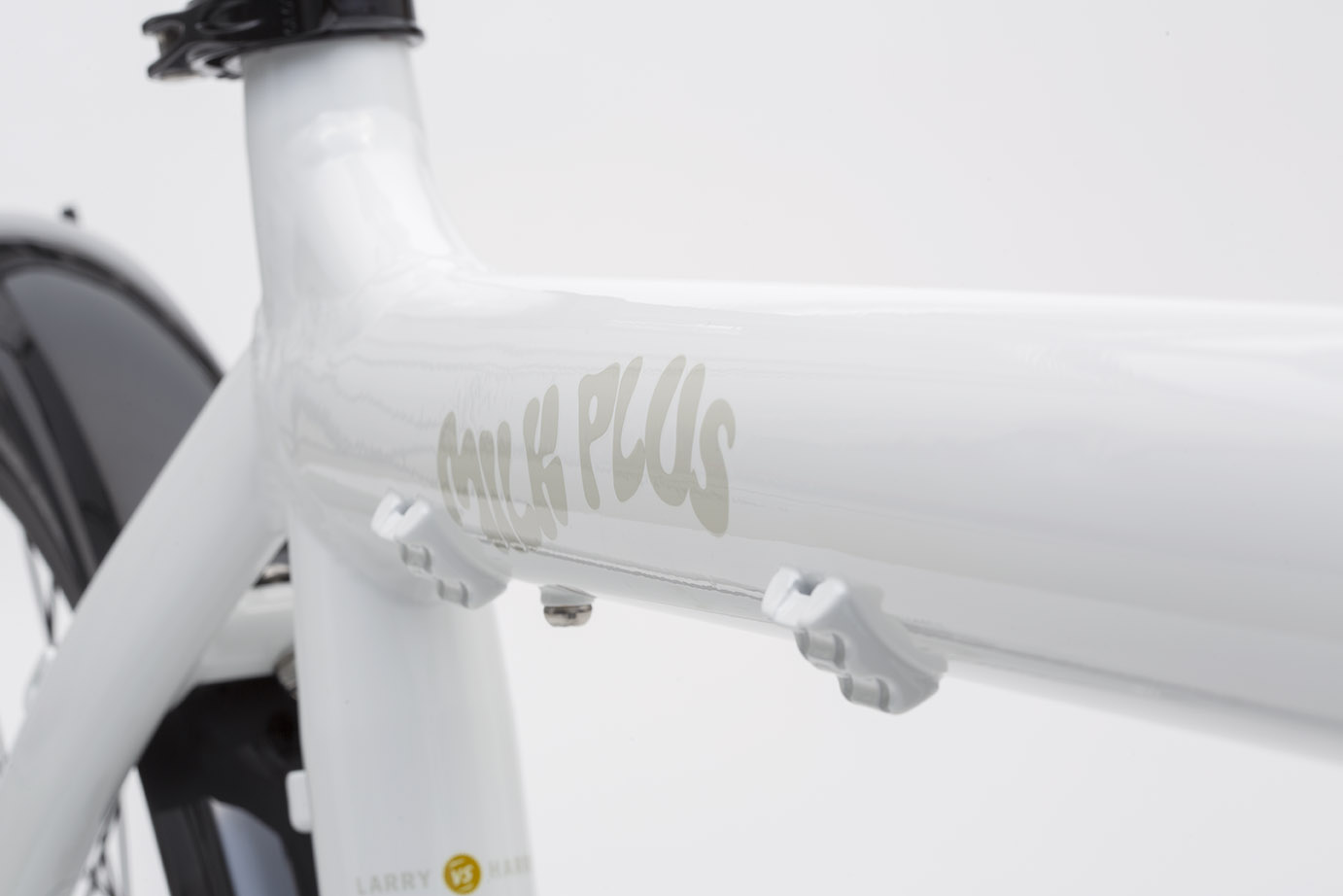 Close up of the toptube of a Milk Plus (white) coloured Bullitt cargo bike 